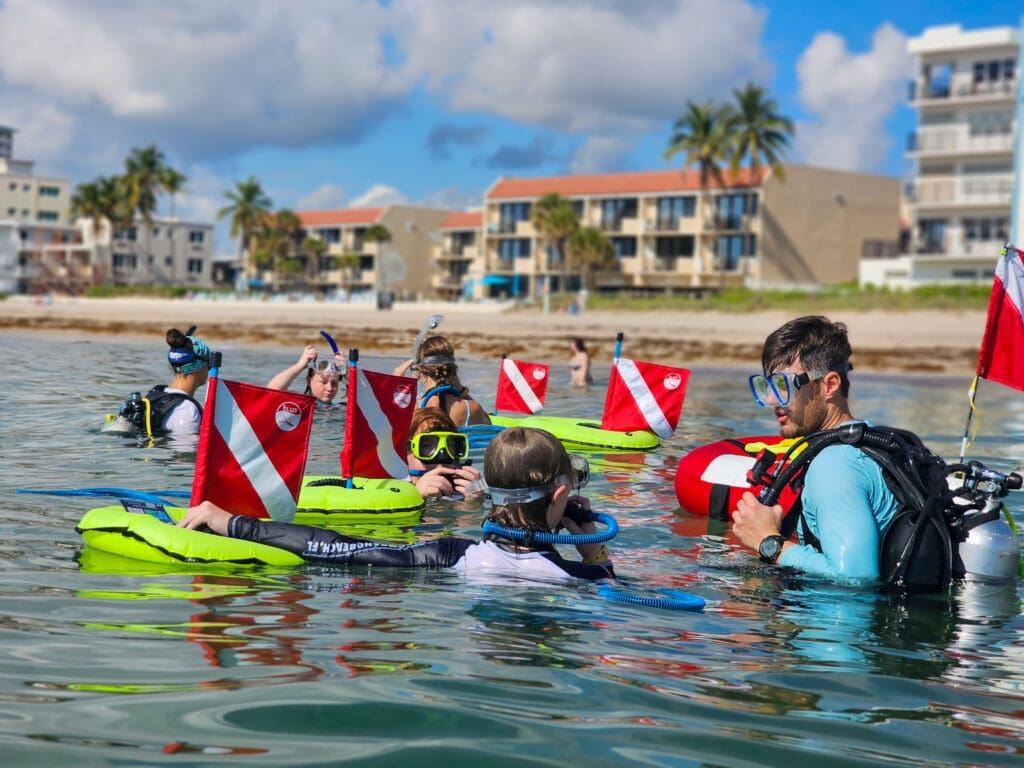 Dive Master Conducting Skills Check with Group for BLU3 Guided Dive Tour