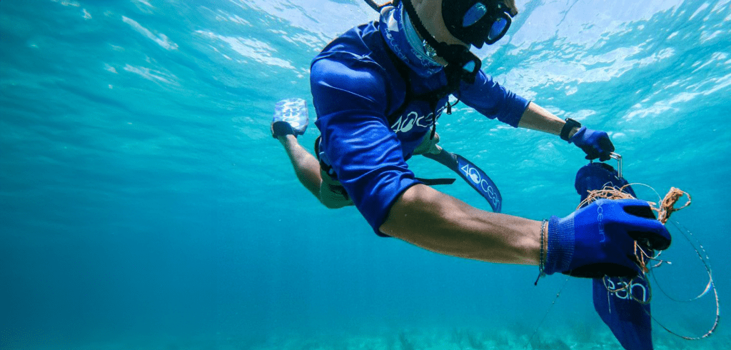 nomad-dive-system-underwater-cleanup-biscayne-bay Alex from 4Ocean using BLU3 dive systems to collect trash underwater.