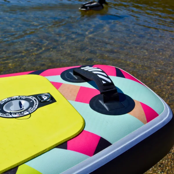 Close-up of the inflation valve and carry handle on the 10'6 Royal Hawaiian Palm inflatable paddle board by POP Board Co.