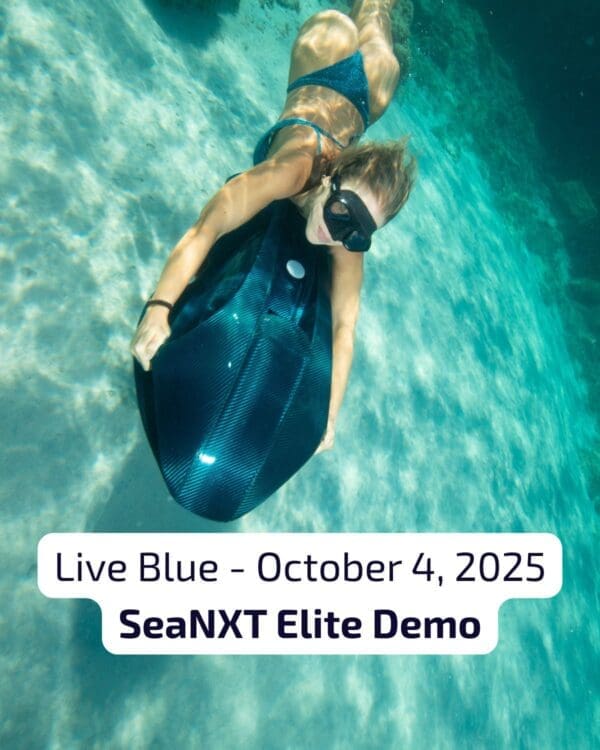 Woman underwater riding a SeaNXT Elite carbon fiber sea scooter during Live Blue demo event, October 4, 2025.